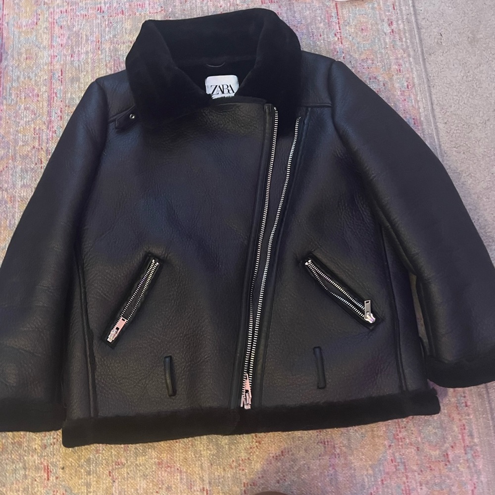 black leather and fur jacket